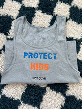 Load image into Gallery viewer, Protect kids not guns cropped tank
