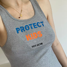 Load image into Gallery viewer, Protect kids not guns cropped tank
